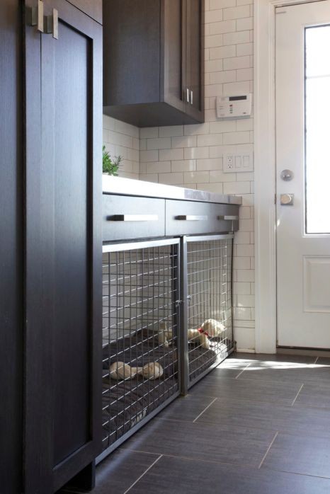 Built-in dog crate seamlessly integrated into kitchen island.