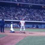 Pete Rose at bat in a game at Dodger Stadium during the 1970s, showcasing his iconic batting stance and determination, key elements of his record-setting baseball career.