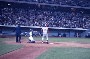 Pete Rose at bat in a game at Dodger Stadium during the 1970s, showcasing his iconic batting stance and determination, key elements of his record-setting baseball career.