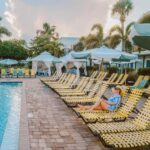 Relaxing by the pool at Postcard Inn on the Beach in St. Pete Beach, Florida