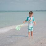 Kid enjoying the beach in Pass-a-Grille, St. Pete Beach, Florida