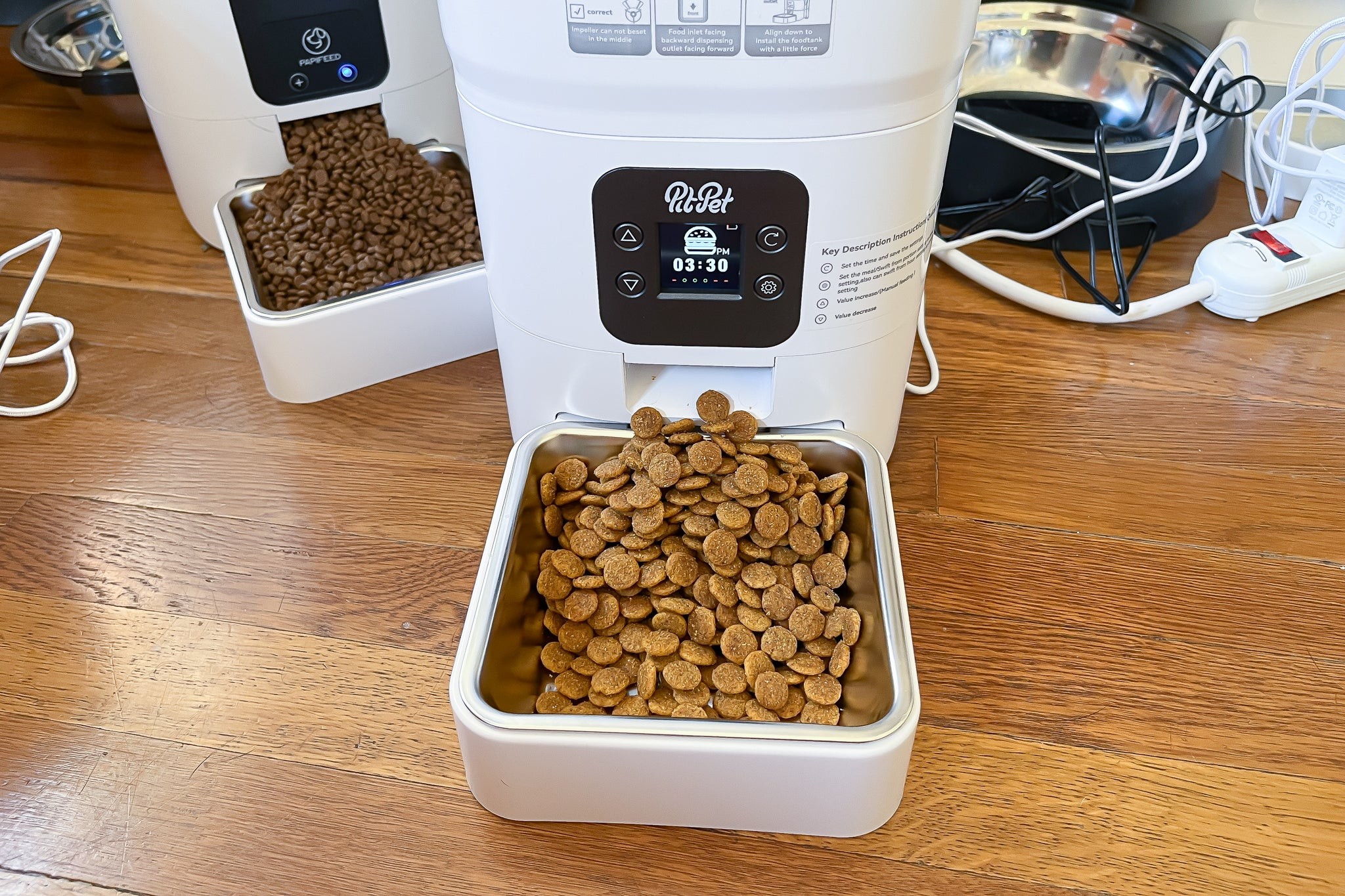 One of the automatic pet feeders we tested for this guide, shown full of dog kibble.