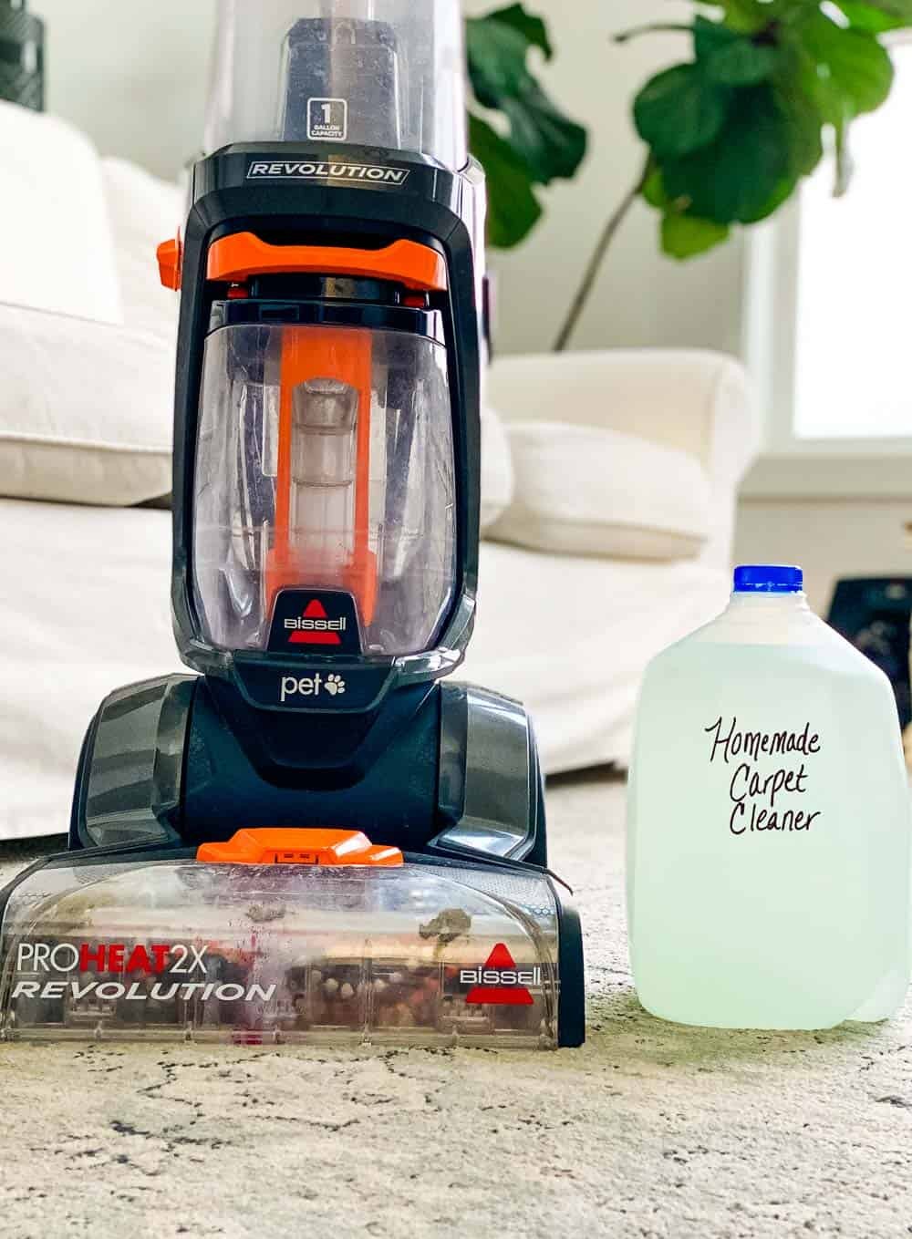 Carpet cleaner next to a jug labeled 