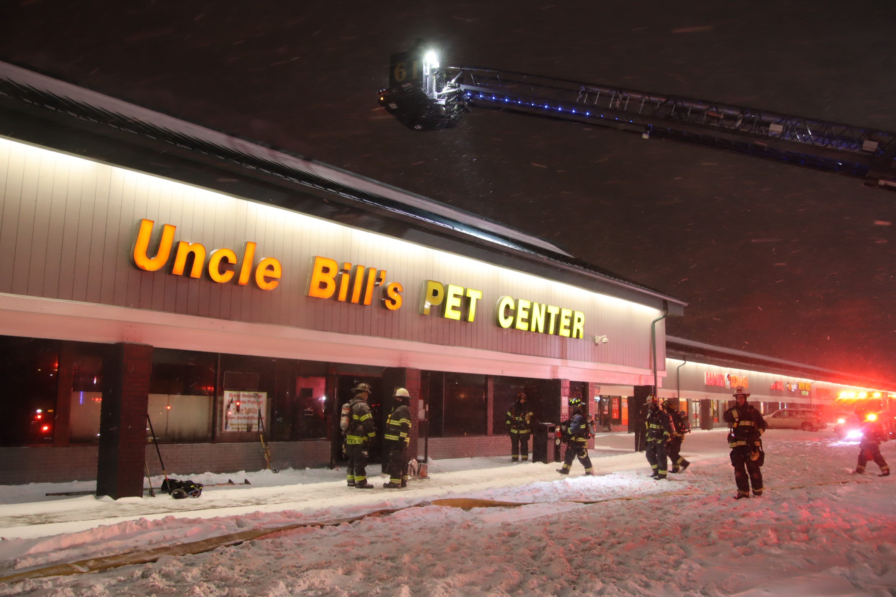 Image of firefighters responding to Uncle Bill's Pet Center fire at night