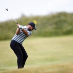 Peter Finch in action, demonstrating his golf swing on the fairway, during a regional qualifying event.