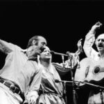 Paul Stookey, left, Mary Travers and Peter Yarrow, who make up the folk group Peter, Paul and Mary, perform in Chicago, July 31, 1983.