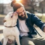 Dog and owner relaxing at a pet-welcoming extended stay hotel