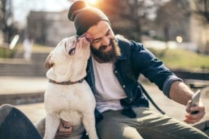 Dog and owner relaxing at a pet-welcoming extended stay hotel