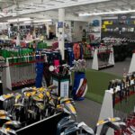 Pete Carlson's Golf & Tennis boasts a massive year-round inventory of golf clubs, displayed prominently in their Palm Desert store.