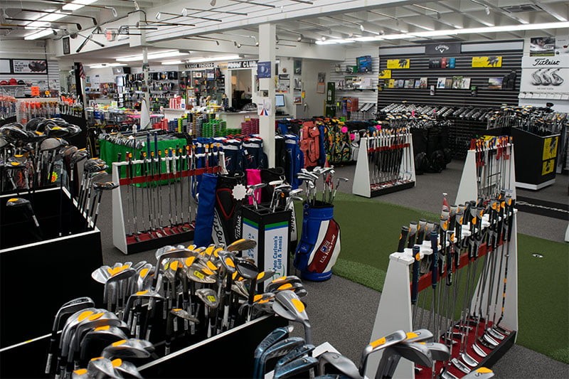 Pete Carlson's Golf & Tennis boasts a massive year-round inventory of golf clubs, displayed prominently in their Palm Desert store.