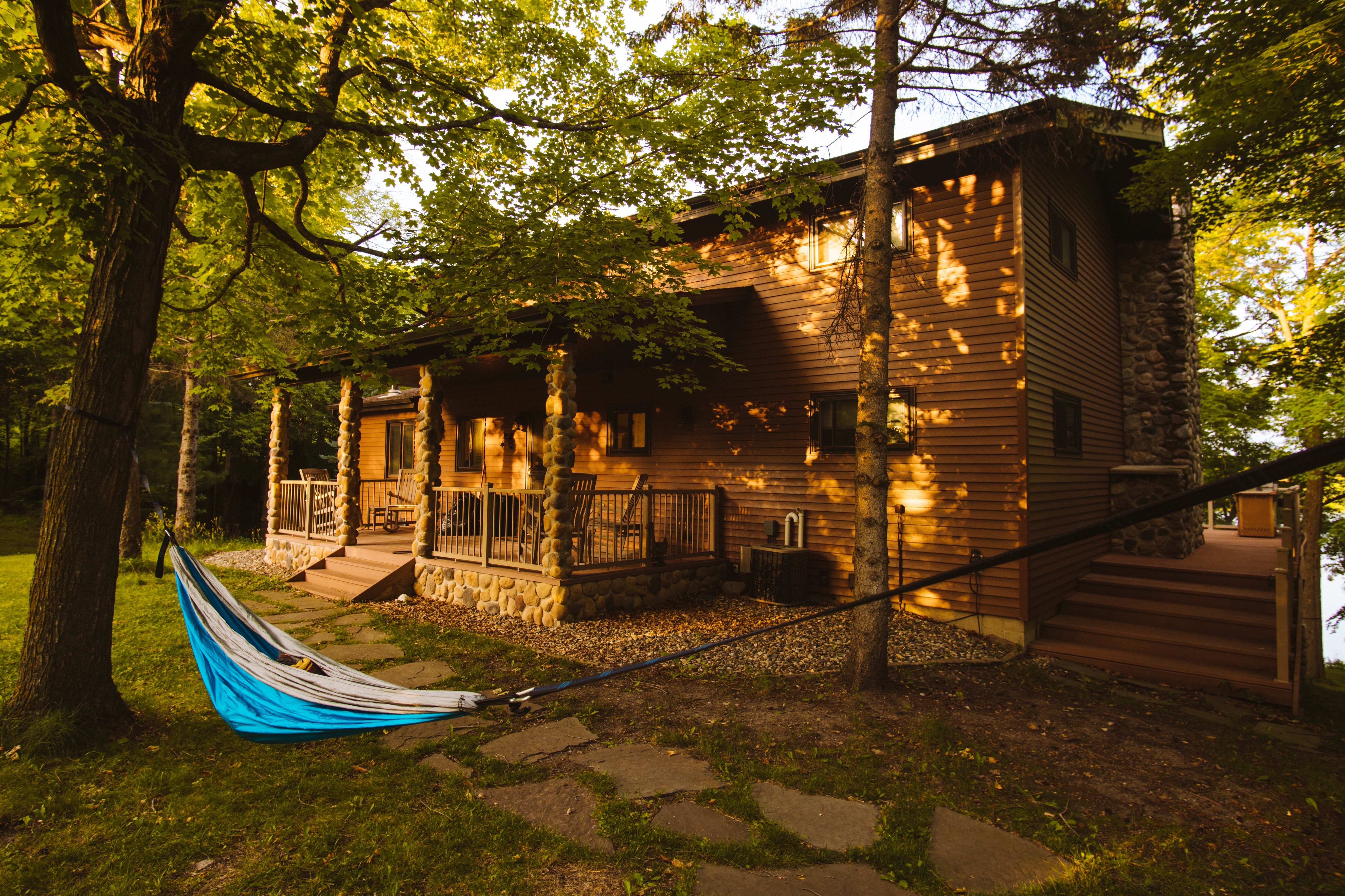 A cozy living room in a pet-friendly cabin with a fireplace and comfortable seating, perfect for relaxing with pets after a day of outdoor adventures in Hocking Hills.