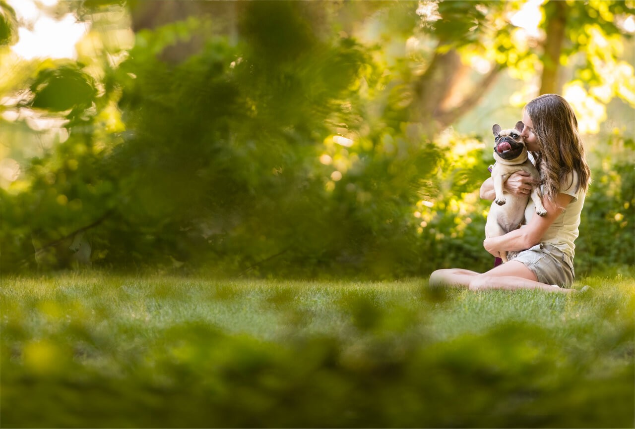 Group of diverse people with their pets smiling and enjoying time together