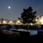 Night view of the Memorial to the Murdered Jews of Europe, emphasizing the grid-like structure and somber atmosphere