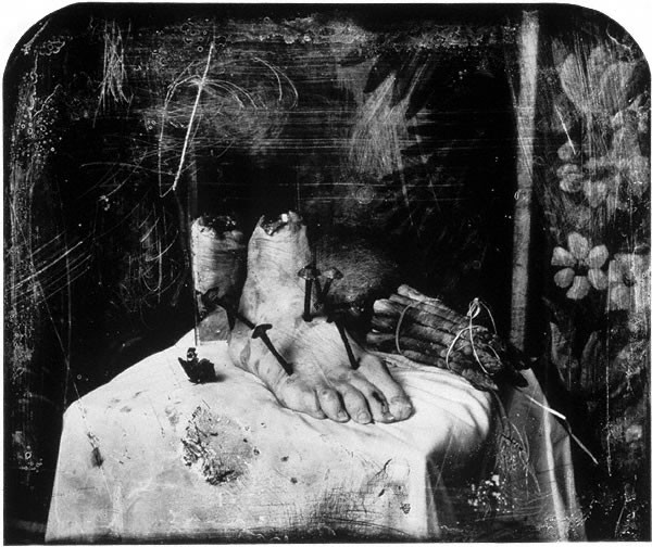 Joel-Peter Witkin's Still Life with Mirror, a 2003 photograph showcasing his signature macabre and surreal style.