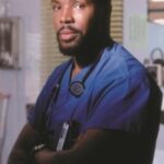 Dr. Peter Benton in ER, portrayed by Eriq La Salle, showcasing his intense dedication to medicine and patient care