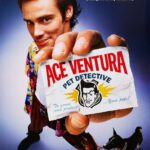 Jim Carrey in Ace Ventura Pet Detective, looking intensely at something off-screen, showcasing his comedic acting style.