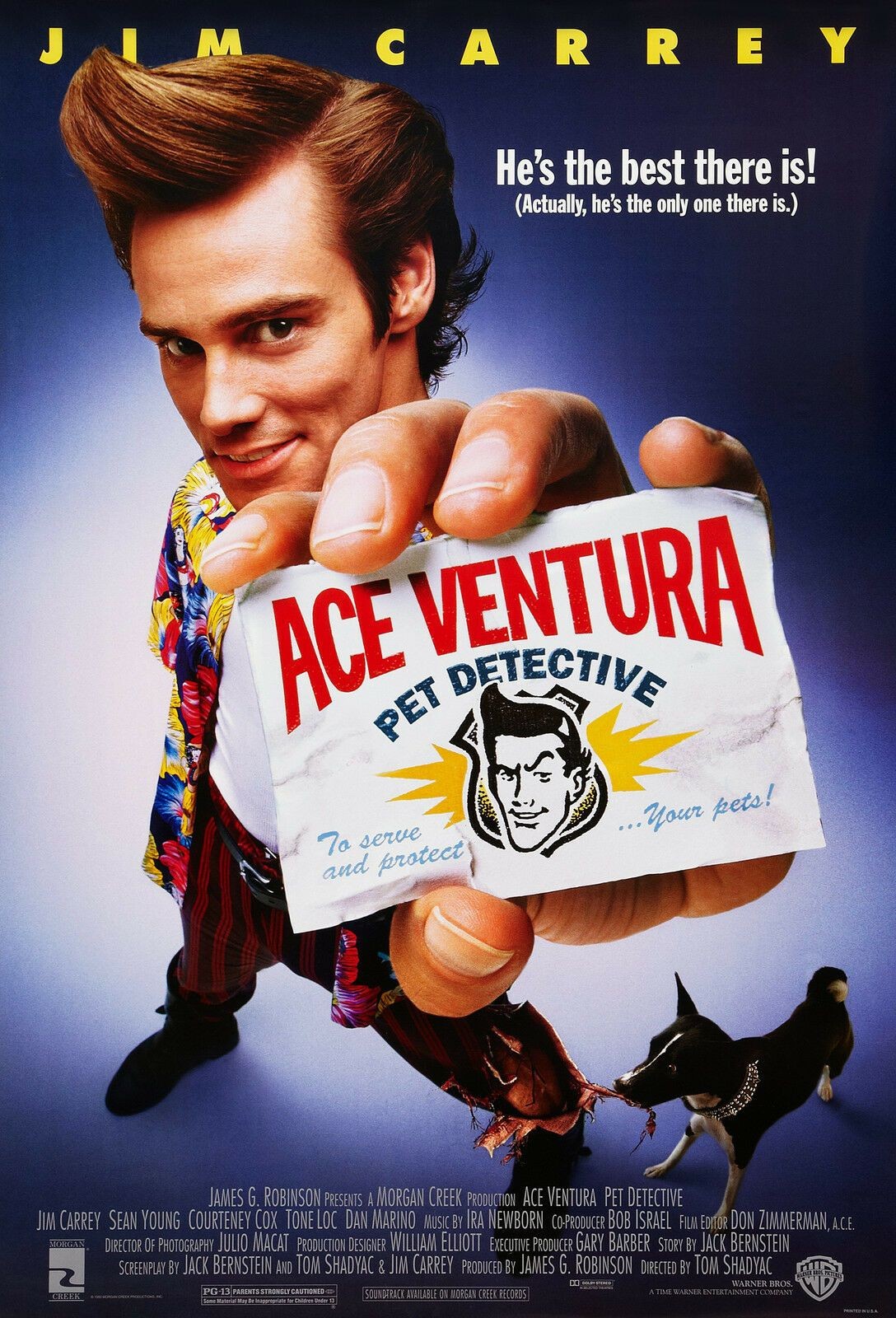 Jim Carrey in Ace Ventura Pet Detective, looking intensely at something off-screen, showcasing his comedic acting style.