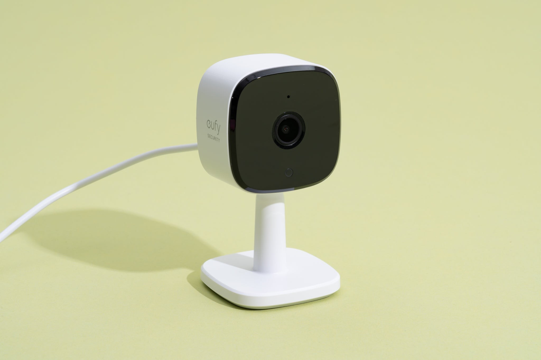 A close-up studio shot of the Eufy Indoor Cam C120 showcasing its compact design and lens, ideal for home monitoring of pets.