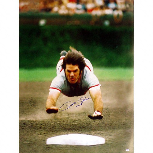 Pete Rose slides headfirst into third base, showcasing his aggressive and iconic playing style for the Cincinnati Reds.