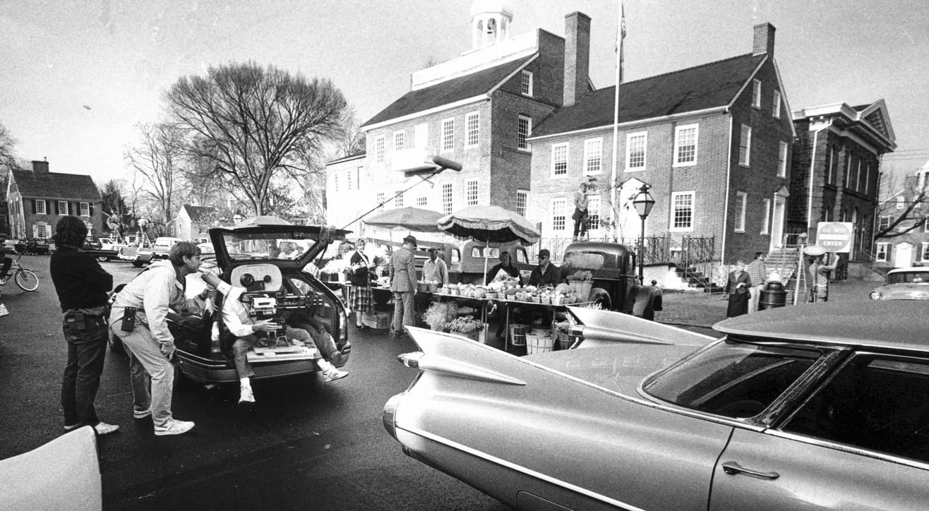 Peter Weir on set, directing Dead Poets Society, highlighting his hands-on approach to filmmaking.