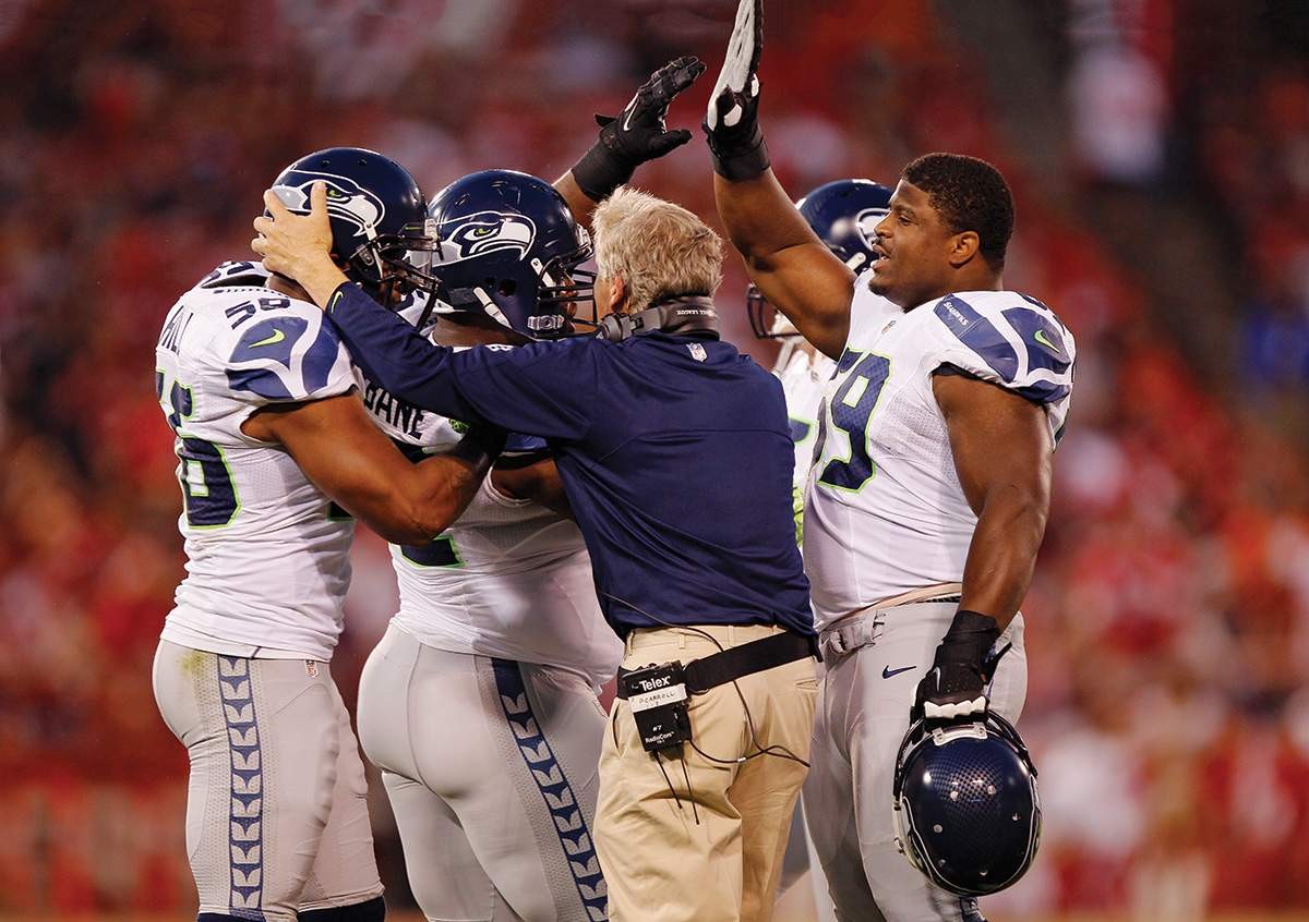 Pete Carroll congratulates players