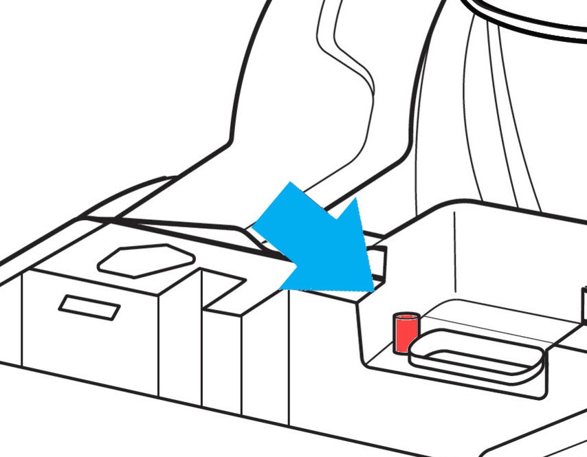 Checking for water flow from the spray port of a Bissell ProHeat 2X Revolution Pet Pro, indicating successful priming