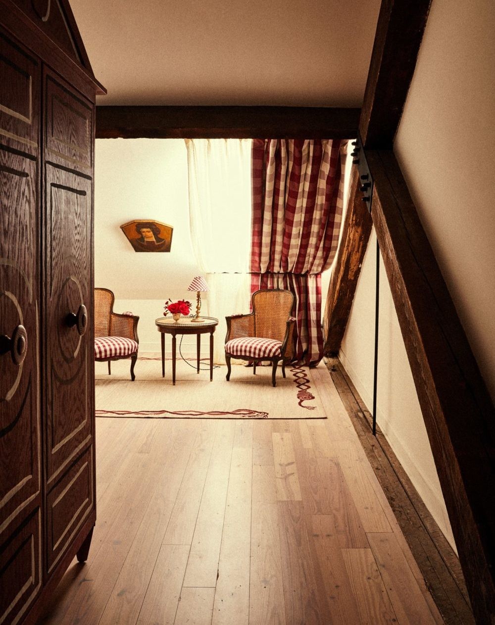 Hotel Peter and Paul Schoolhouse Guest Room with Red Floor, showcasing the unique interior design and historic charm.