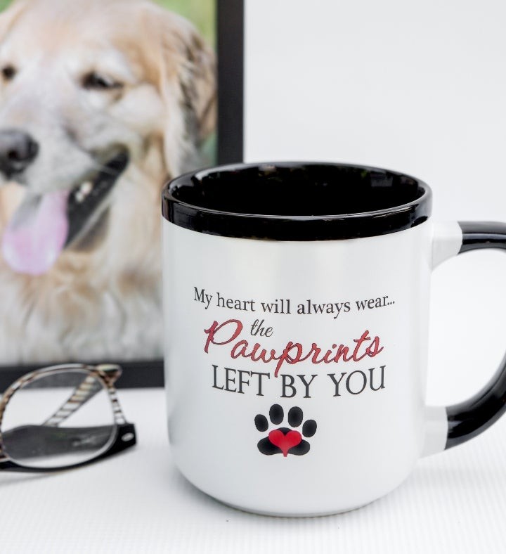 Heart Felt, showing a pet memorial mug with paw prints, a comforting keepsake for those grieving the loss of a beloved animal companion.