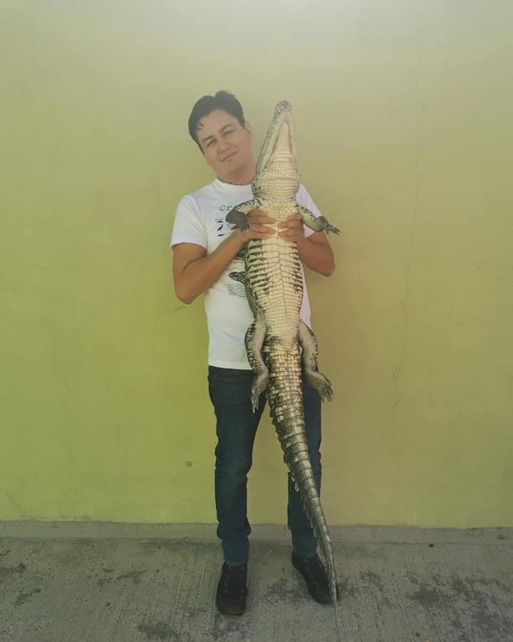 Pictured: Jonathan Araiza with his pet crocodile Gamora.