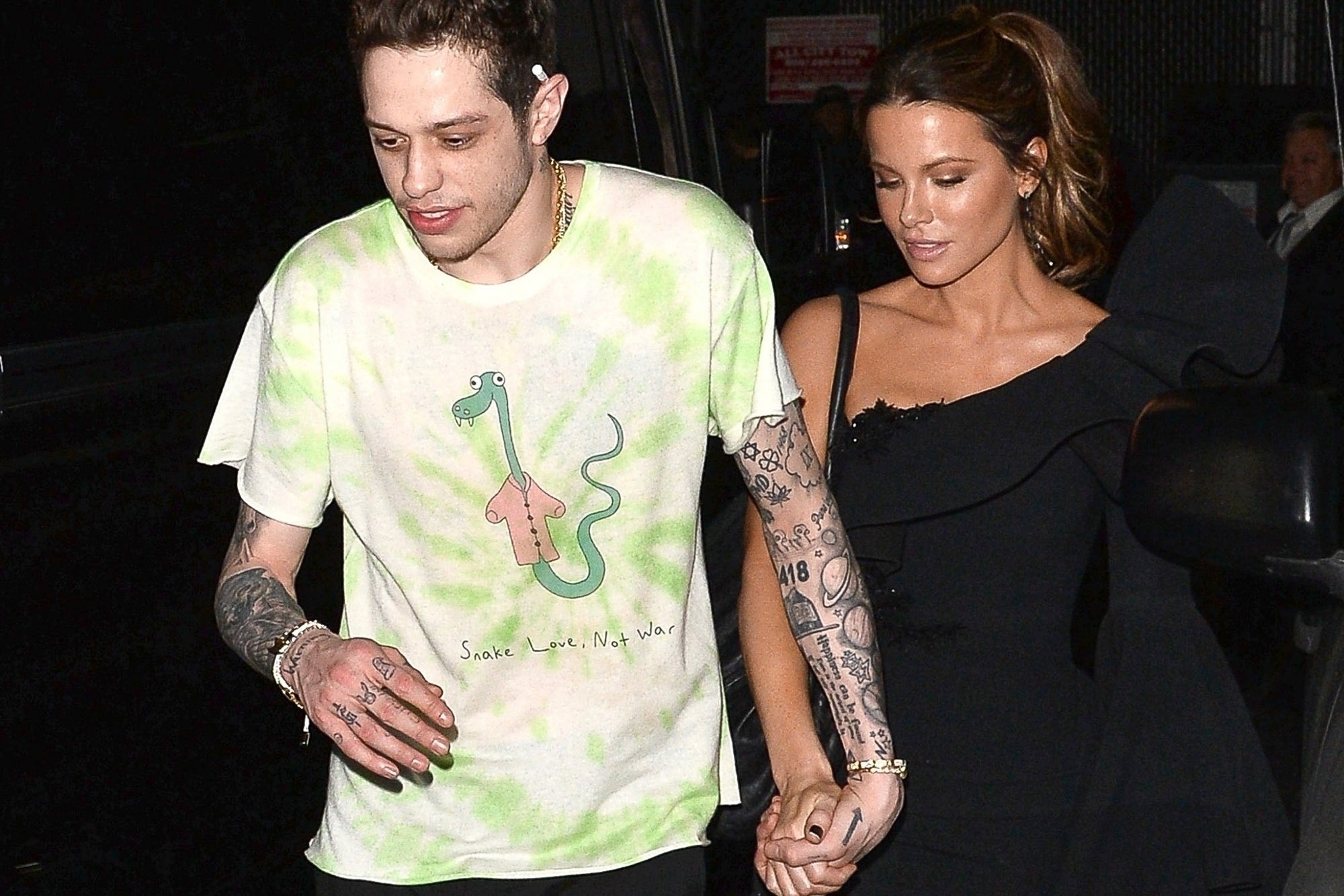 Kate Beckinsale and Pete Davidson, looking off in the distance